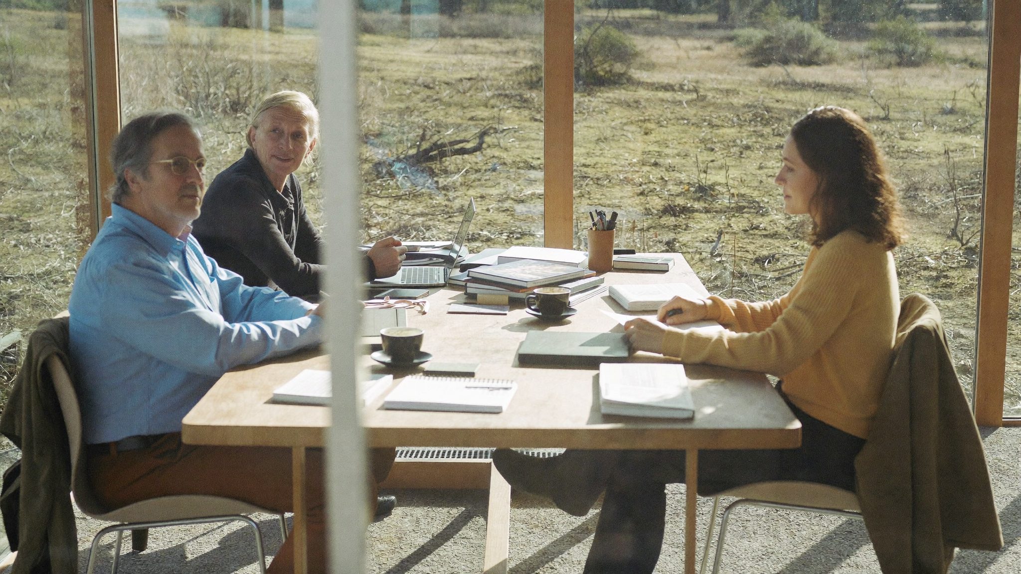 A printed financial plan open on a desk with a pen